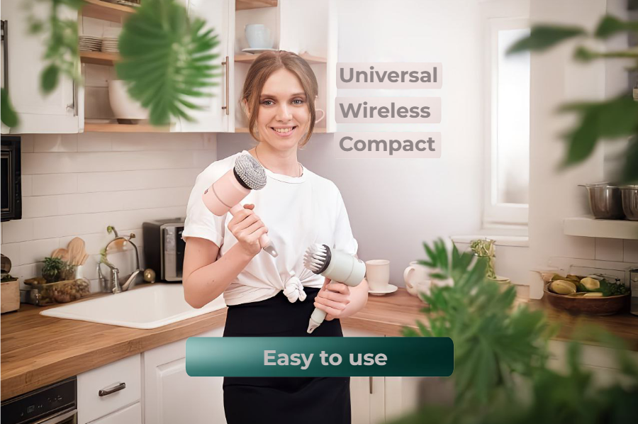 "Happy woman in kitchen displaying the easy-to-use SpotLess Universal Wireless Compact scrubber"
